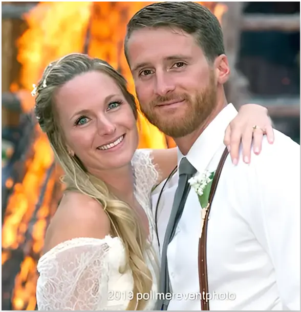 A man and woman posing for a picture.